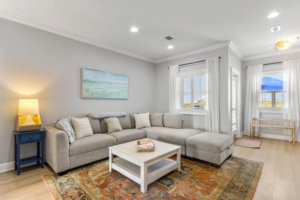 Sectional sofa and coffee table by the windows
